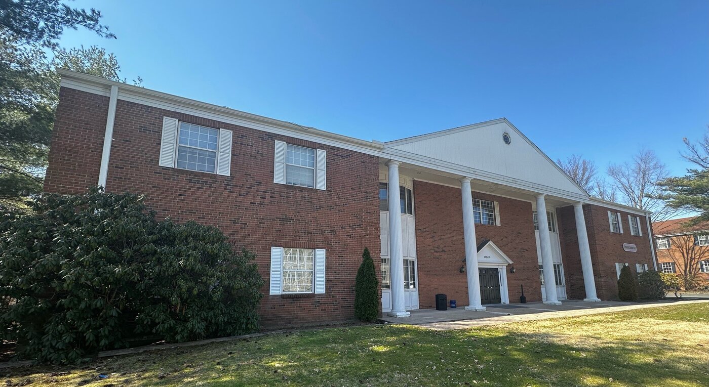 693 Bloomfield Avenue, a colonial-style brick office building with white columns